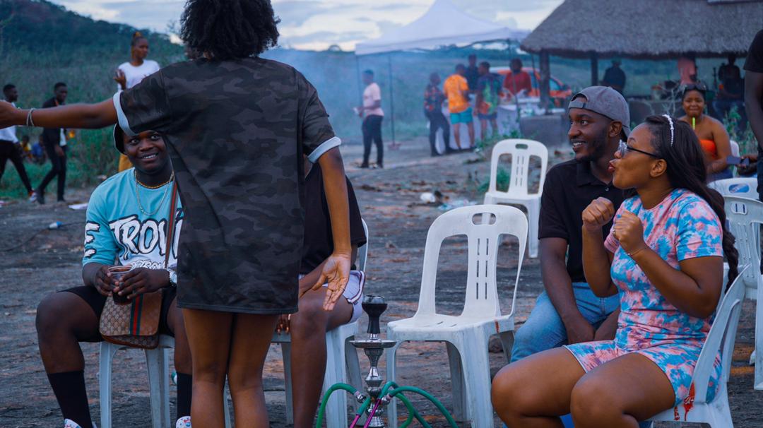 Scenes from 2023 Hilltop Festival Event- Shisha; - a type of flavoured tobacco blended with glycerine, molasses, and various flavourings, smoked through a hookah. see figure with green tubes and silver casing